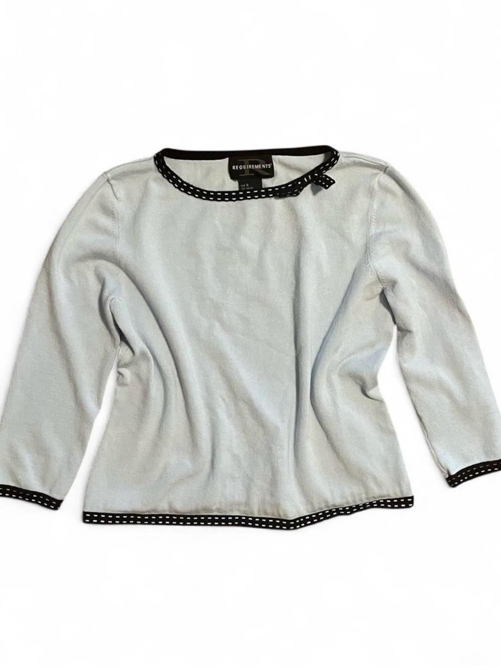 REQUIREMENTS Light Blue Sweater with Black & White Polka Dot Trim